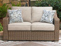Beachcroft New Beige Outdoor Loveseat with Cushion