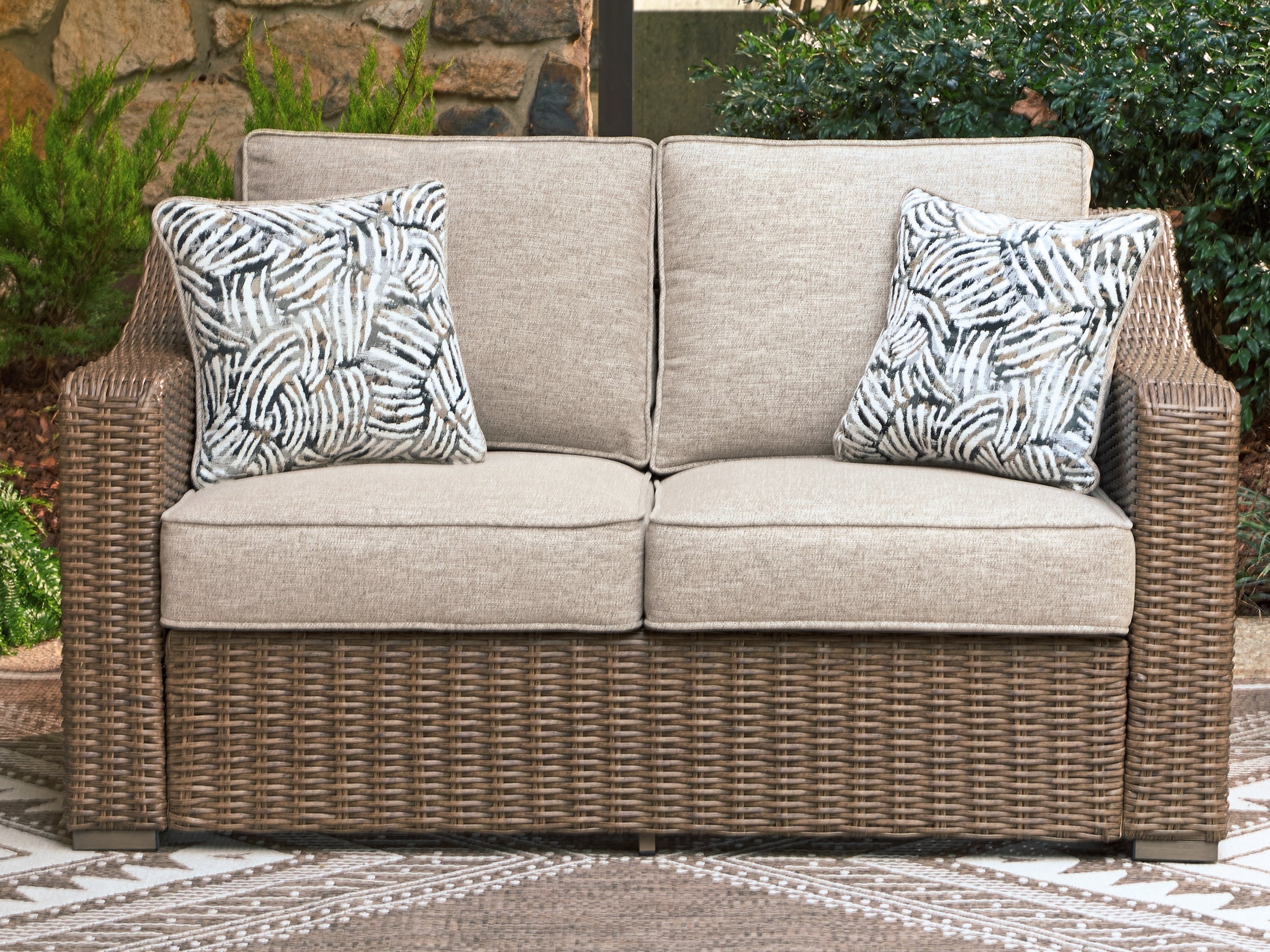 Beachcroft New Beige Outdoor Loveseat with Cushion