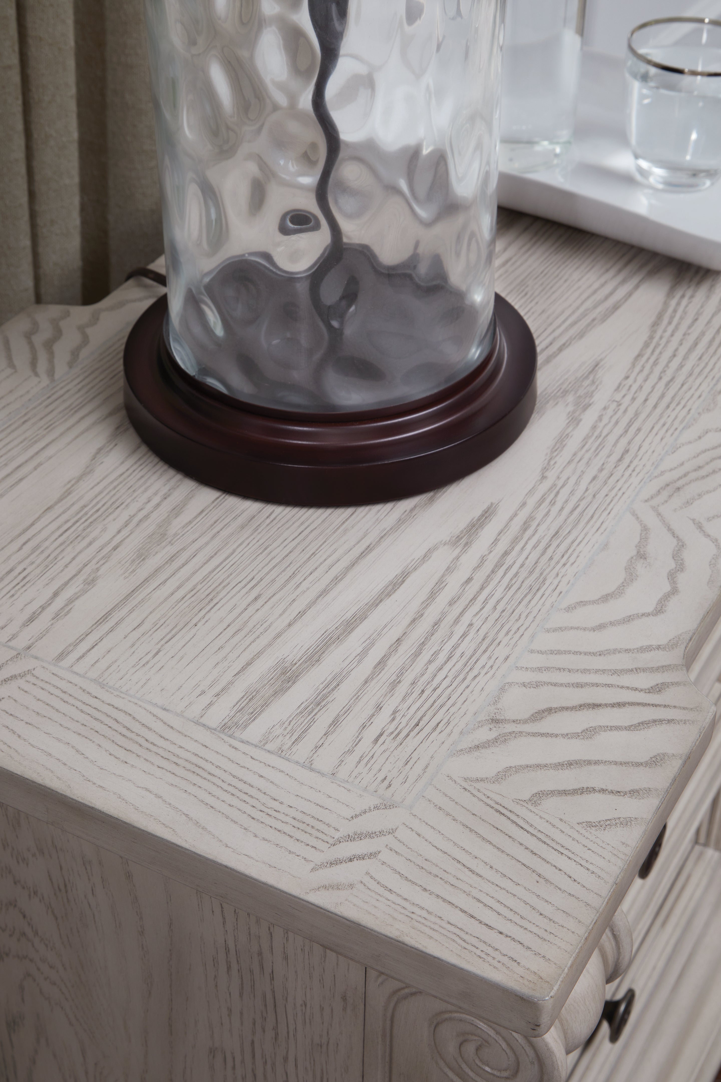 Bruchandi Antique White Three Drawer Night Stand