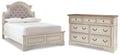 Realyn Two-tone Full Upholstered Panel Bed and Dresser